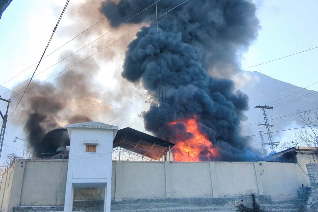 Smoke and flames rise from the UN office in Gilgit, Pakistan, after it is set ablaze by protesters on Sunday. Photo: Reuters