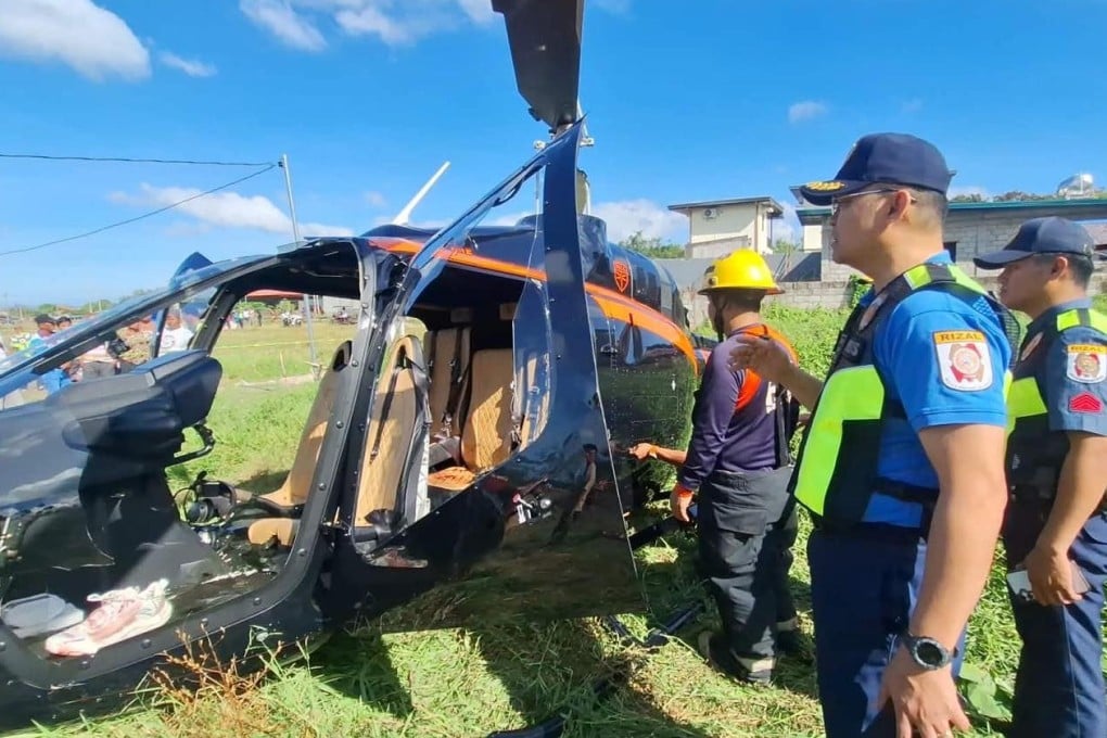 Police officers inspect the wreckage of a helicopter that crashed in Rizal on Tuesday. Photo: Rizal Provincial Police Office