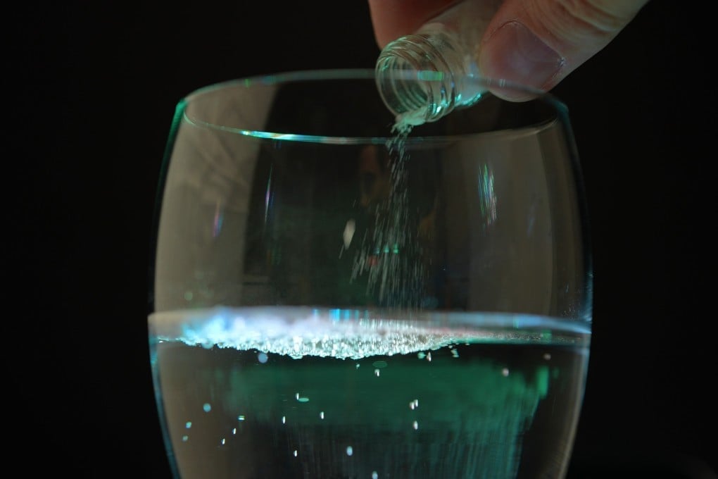 A person spiking an alcoholic drink. Photo: Shutterstock