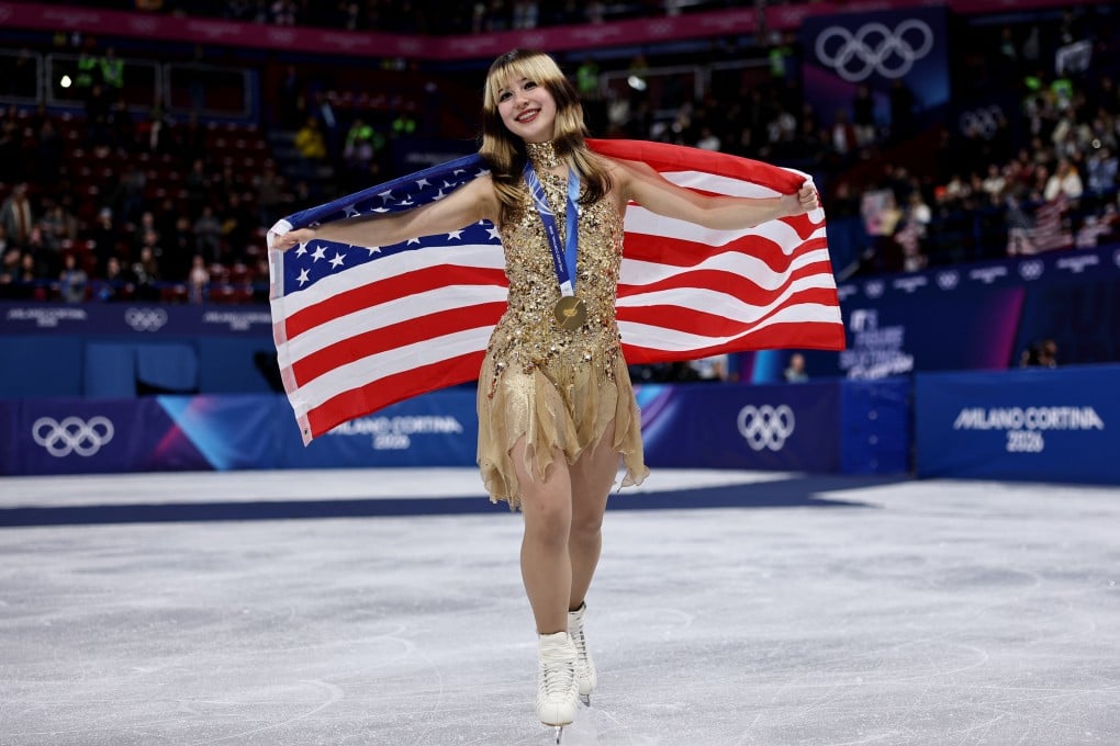 US gold medallist Alysa Liu celebrates victory with her national flag in Milan, Italy, on February 19. Photo: Reuters
