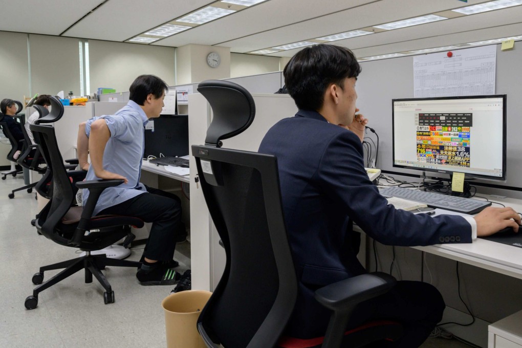 Officials at the Korea Communications Standards Commission hunt and remove sex videos posted without consent in 2019. The AI system helps ease the psychological burden on workers who previously had to review abusive content frame by frame. Photo: AFP