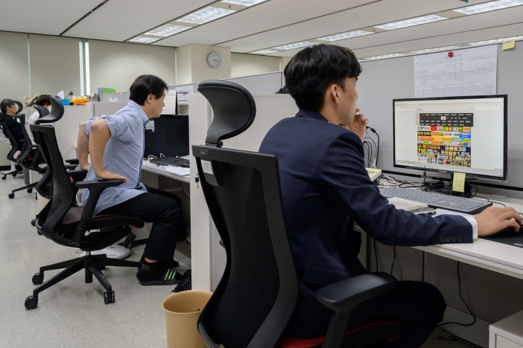 Officials at the Korea Communications Standards Commission hunt and remove sex videos posted without consent in 2019. The AI system helps ease the psychological burden on workers who previously had to review abusive content frame by frame. Photo: AFP