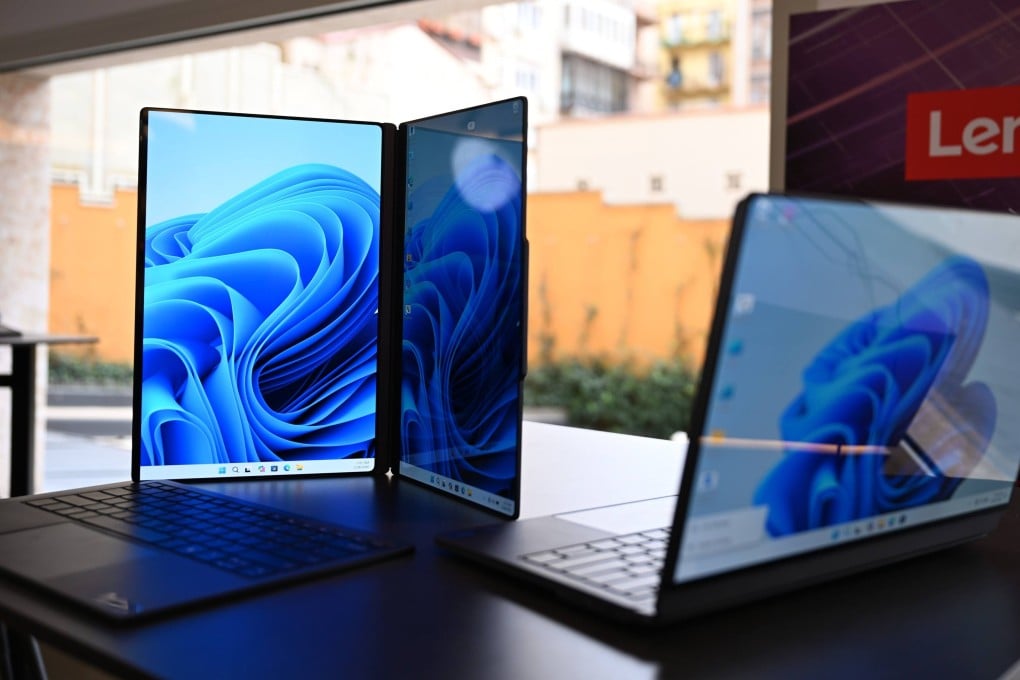 Dual-screen laptops from Chinese manufacturer Lenovo, still in the development stage, are displayed at MWC Barcelona 2026. Photo: Wolf von Dewitz/dpa