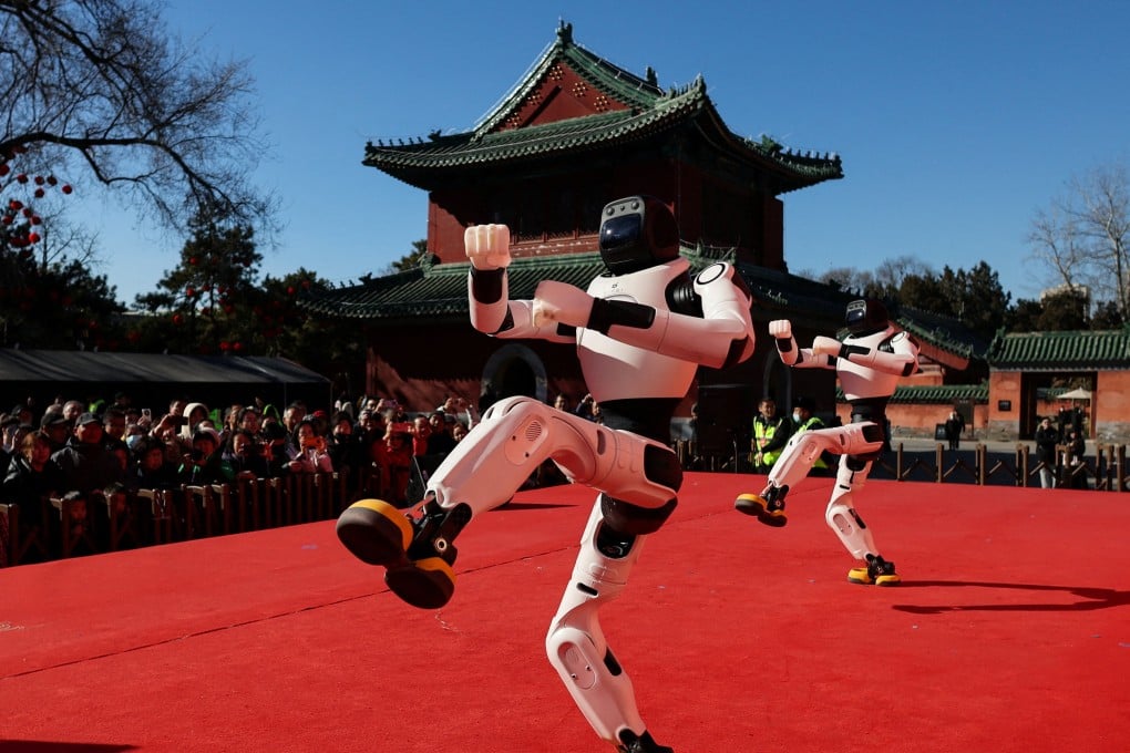 People watch as robots perform a dance during Lunar New Year celebrations in Beijing on February 18. Photo: Reuters