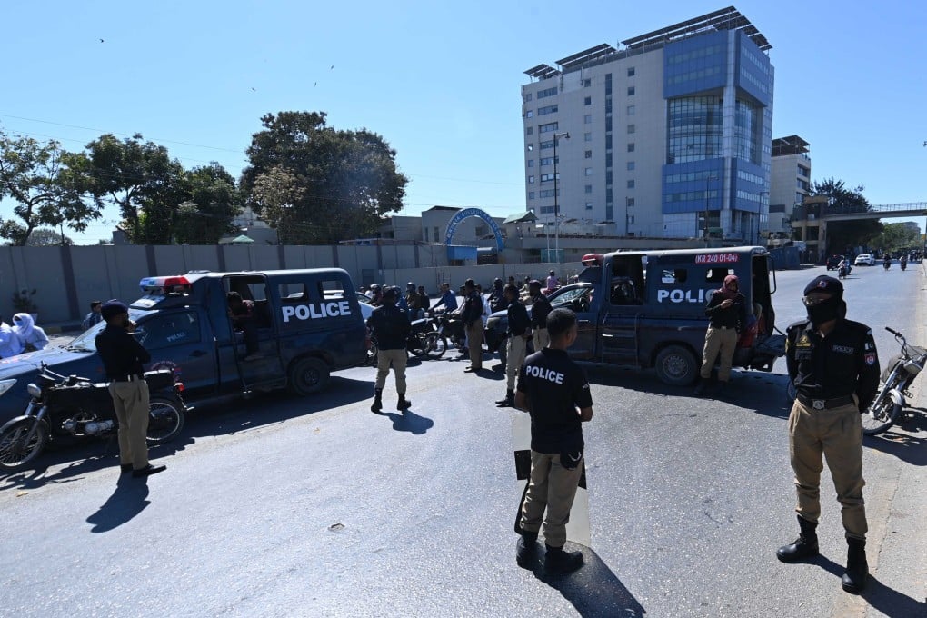 Pakistani security officers stand guard at the entrance to the US consulate in Karachi on Wednesday. Photo: EPA