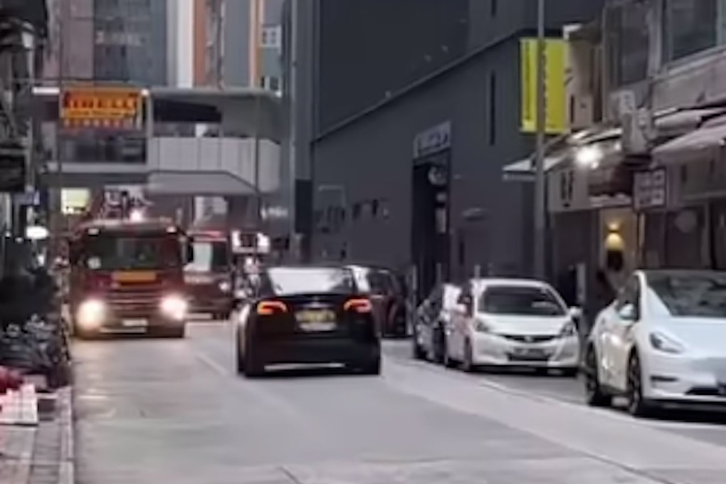 The viral video clip showed a black car driving against the flow of traffic in Wan Chai. Photo: Handout