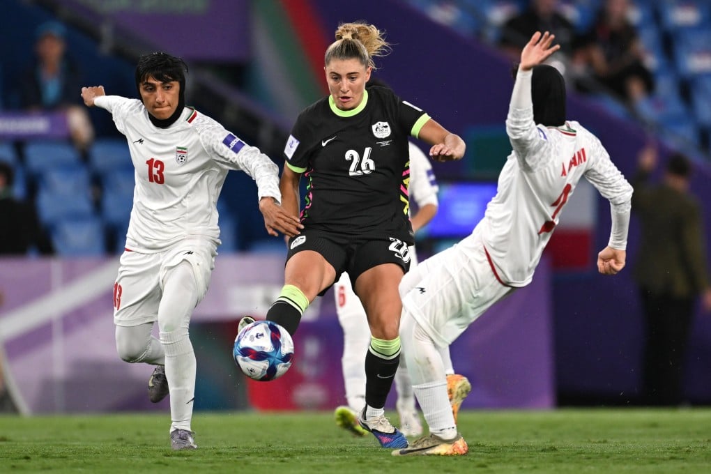 Australia’s Remy Siemsen (centre) wards off Iran’s Fatemeh Amineh (left) and Atefah Imani during their AFC Women’s Asian Cup group A match at Cbus Super Stadium on the Gold Coast on Thursday. Photo: EPA