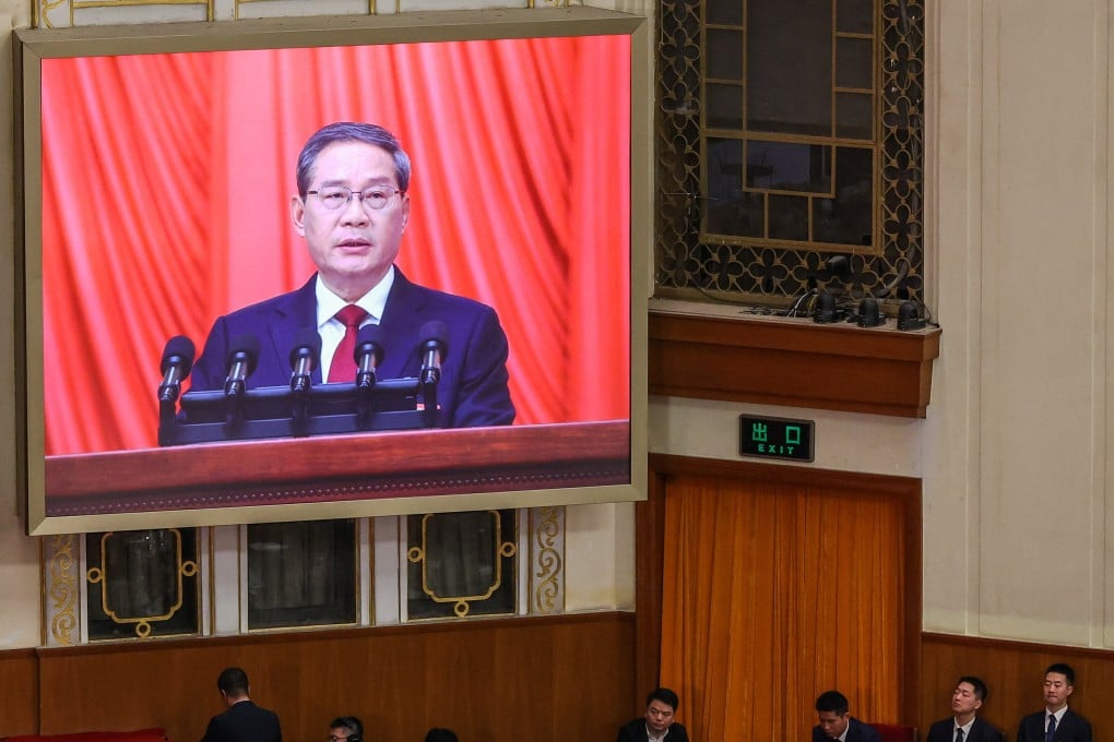 Premier Li Qiang is visible on a screen during the opening session of the National People’s Congress at the Great Hall of the People in Beijing on Thursday. Photo: Reuters