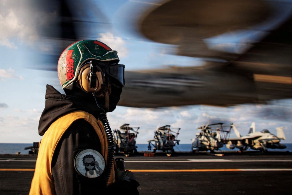 A sailor observes the landing of an E-2D Hawkeye on the aircraft carrier USS Gerald R. Ford while operating in support of the Operation Epic Fury attack on Iran in the eastern Mediterranean Sea, on March 2. Photo: US Navy via Reuters