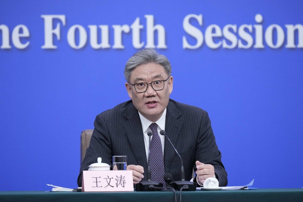 Commerce Minister Wang Wentao speaks at the 14th National People’s Congress in Beijing on March 6. Photo: AFP