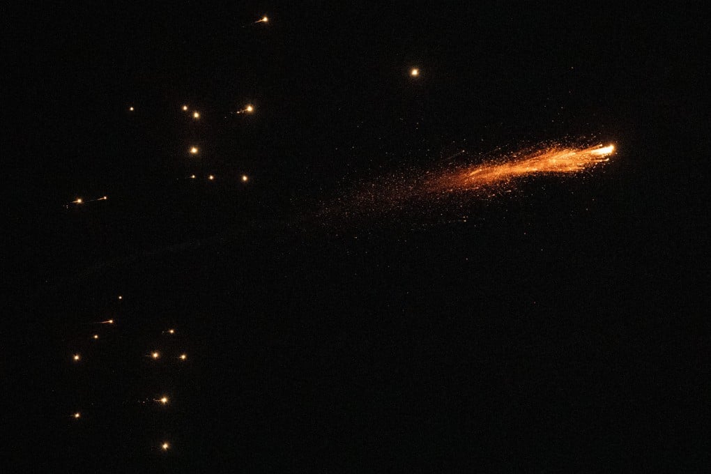 Missile debris falls after Israeli air defence systems launched interceptor missiles over Tel Aviv, Israel on Sunday. Photo: Xinhua