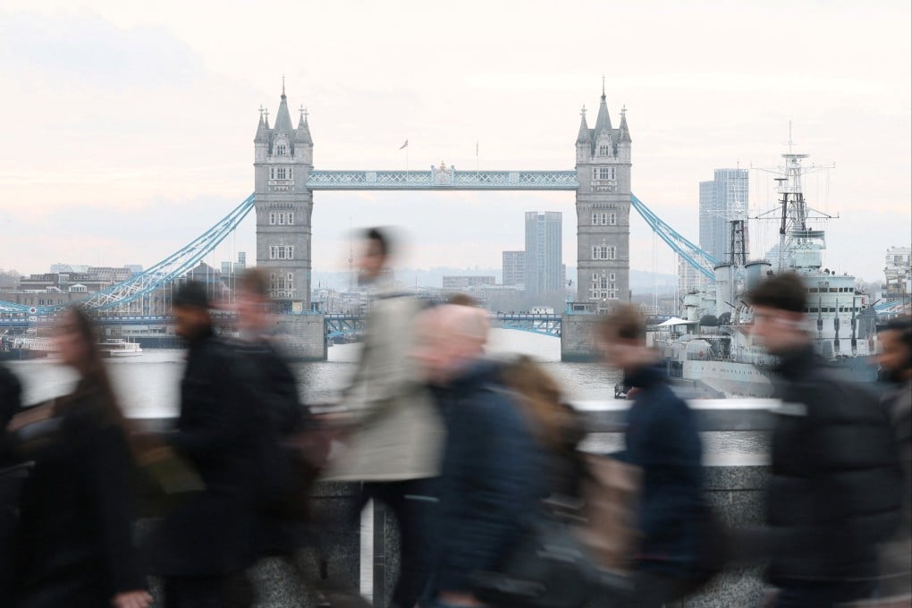 Workers cross London Bridge during the morning rush-hour. Photo: Reuters