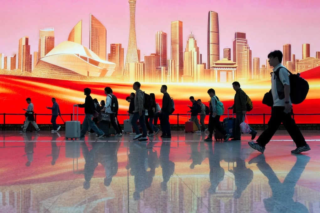 Passengers pass a mural in the arrivals hall of Guangzhou Baiyun International Airport in Guangzhou, in south China’s Guangdong province, on February 23, 2026. Photo: Xinhua