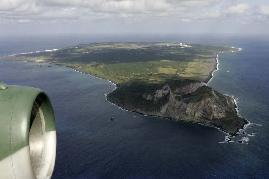 The island of Iwo Jima, with Mount Suribachi in the foreground, is seen from a Japanese Air Self-Defence Force transport plane. Photo: Reuters