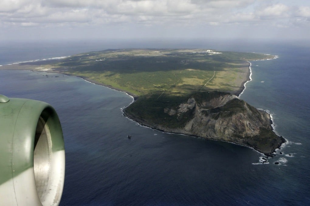 The island of Iwo Jima, with Mount Suribachi in the foreground, is seen from a Japanese Air Self-Defence Force transport plane. Photo: Reuters