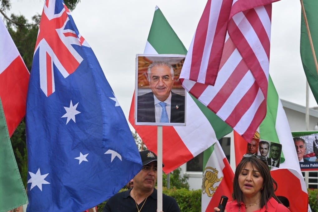 Members of the Iranian diaspora in Australia celebrate US and Israeli military strikes on Iran outside Iranian embassy in Canberra on March 1. Photo: EPA