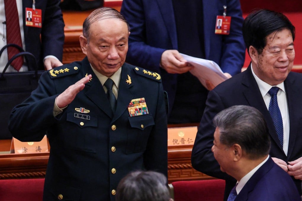 Zhang Shengmin, vice-chairman of the Central Military Commission, salutes Chinese President Xi Jinping in the Great Hall of the People in Beijing on Wednesday. Photo: Reuters