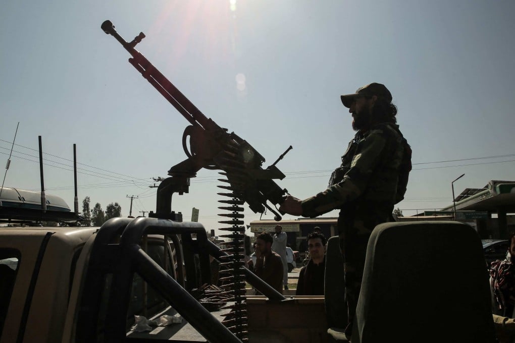 A Taliban security guard rides an armed vehicle on the outskirts of Jalalabad, Afghanistan, on February 28. Photo: AFP
