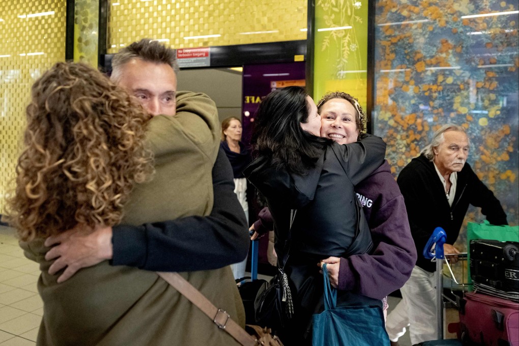 Travellers arrive at Schiphol airport in Amsterdam after returning from the Middle East on Wednesday. Photo: ANP/AFP
