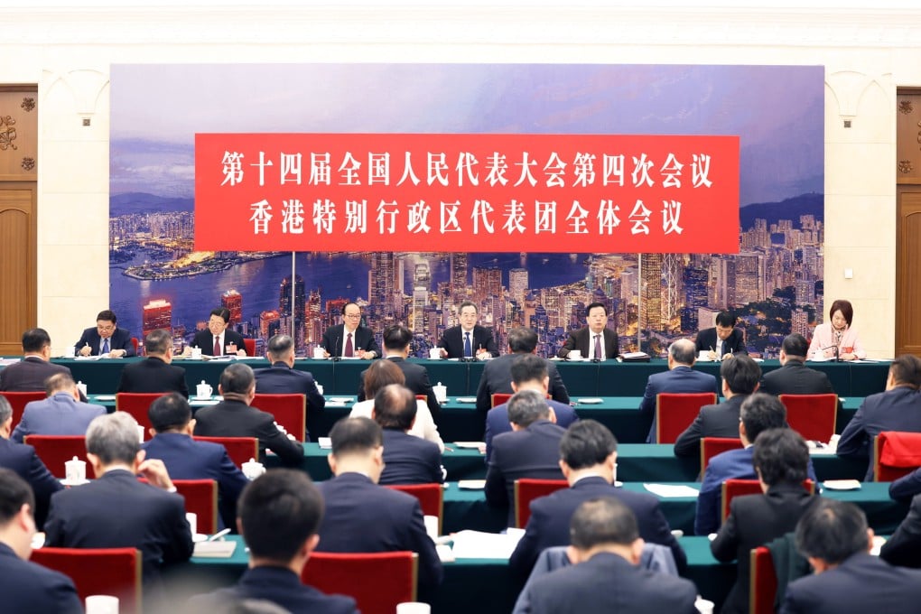 Chinese Vice-Premier Ding Xuexiang (centre) has met the city’s deputies to the national legislature. Photo: Xinhua