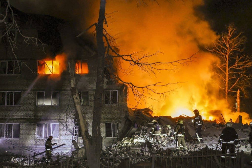 Rescuers work at the site of a fatal missile strike on a residential building in Kharkiv, Ukraine, on Saturday. Photo: EPA