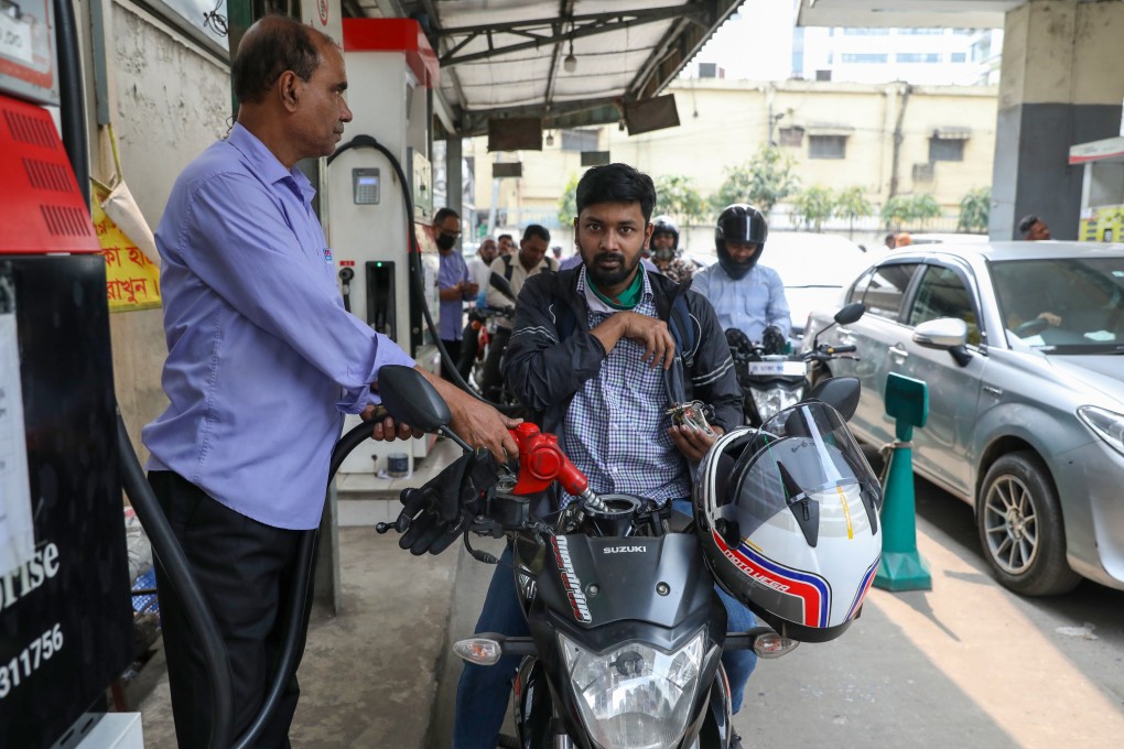 A man refuels his motorcycle at a fuel station in Dhaka, Bangladesh, on Sunday. Photo: EPA-EFE