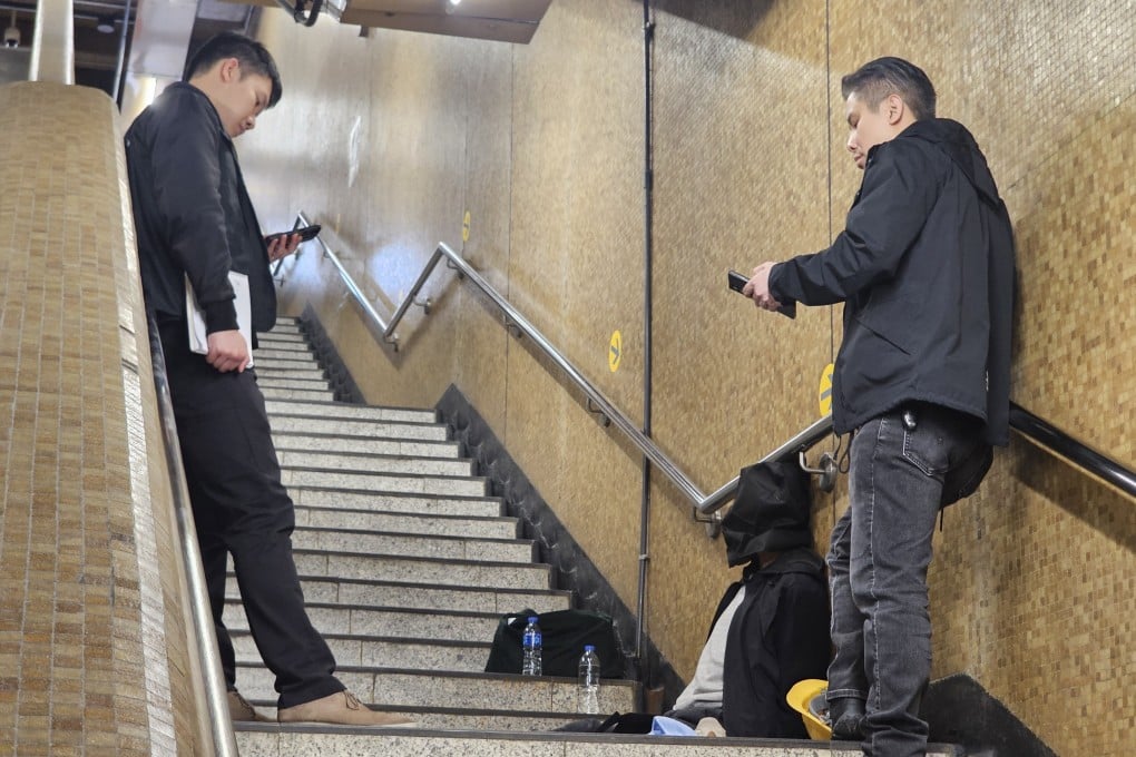 Police with a suspect taken into custody on Friday. Photo: Handout