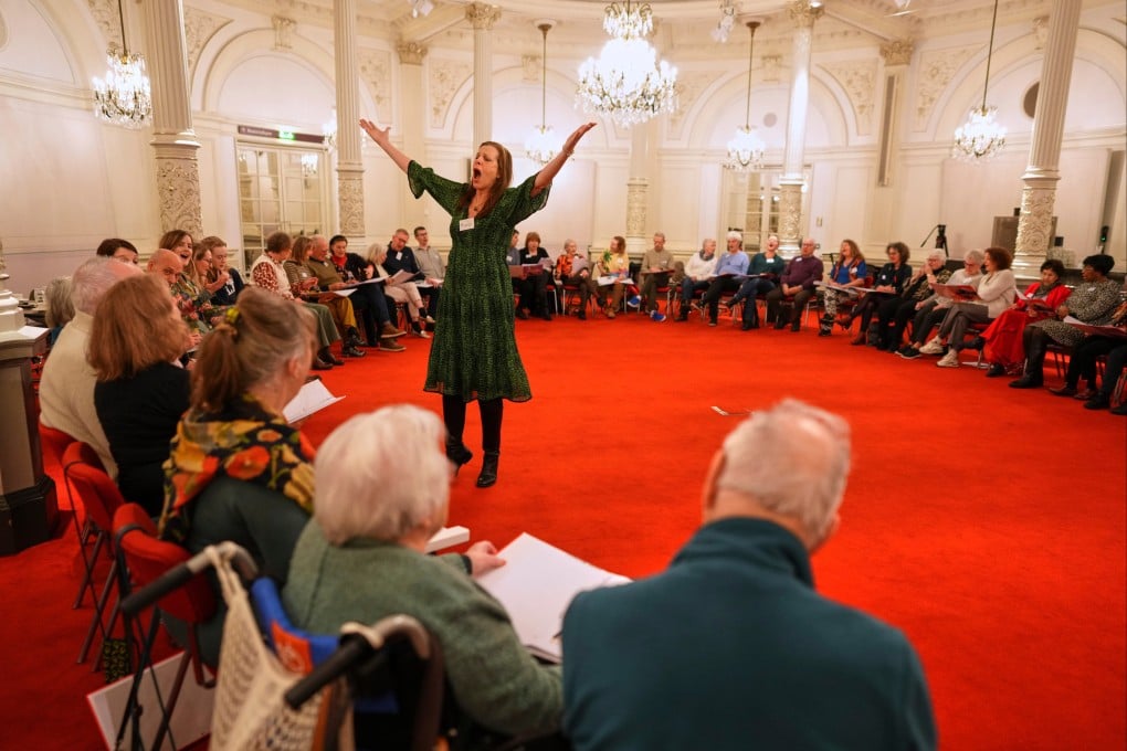 People, many of them seniors with a form of dementia, join in the ‘singing circle’ run by opera singer Maartje de Lint, at the Concertgebouw’s ornate Mirror Hall in Amsterdam on February 24. Photo: AP