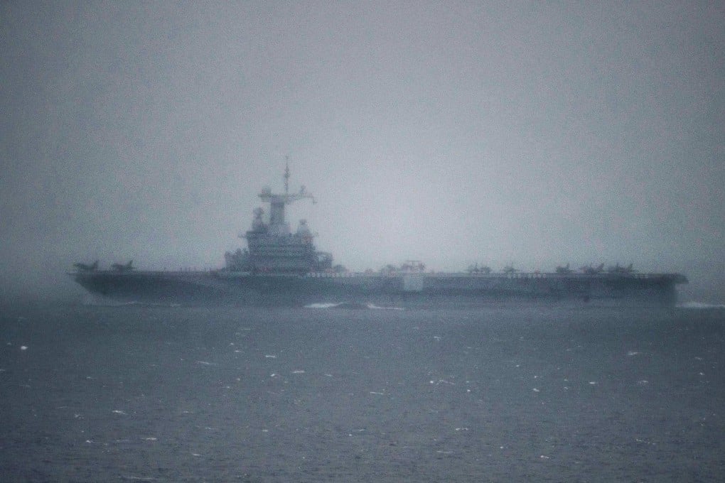 The French aircraft carrier Charles-de-Gaulle passes through the Strait of Gibraltar off the coast of southern Spain in Tarifa on March 6. Photo: AFP