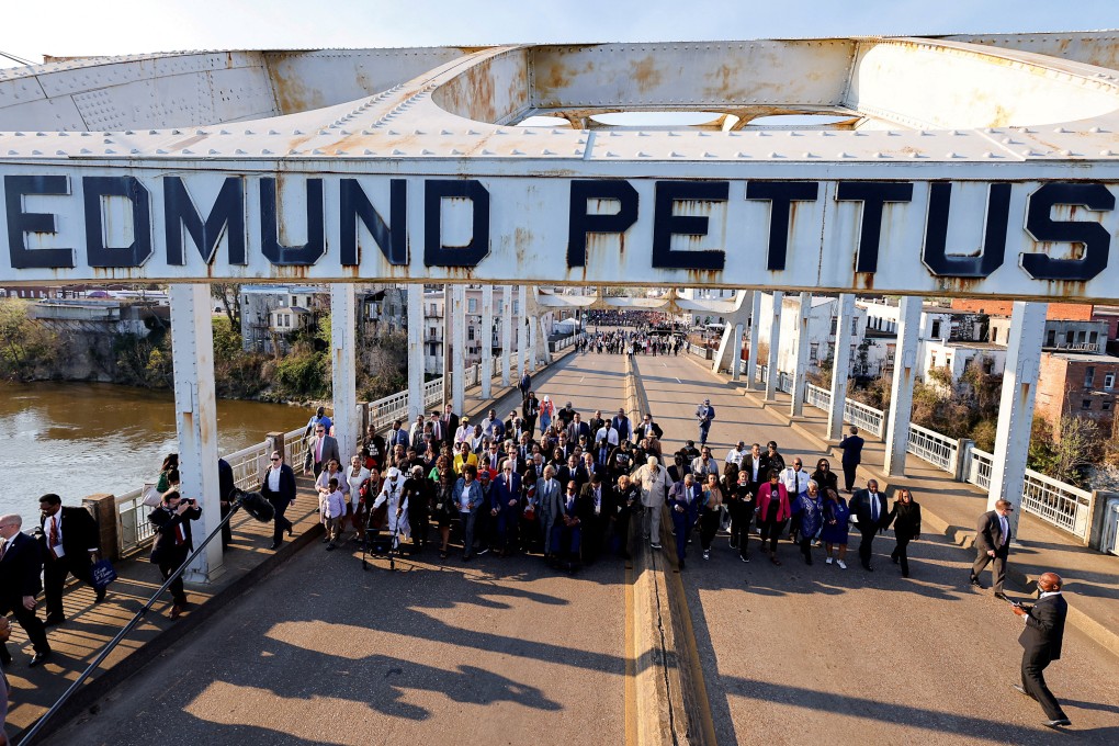 Politicians and activists participate in a commemorative march across the Edmund Pettus Bridge for the 58th anniversary of ‘Bloody Sunday’, when state troopers beat peaceful voting rights protesters who were marching across the bridge, in Selma, Alabama, on Thursday. Photo: Reuters