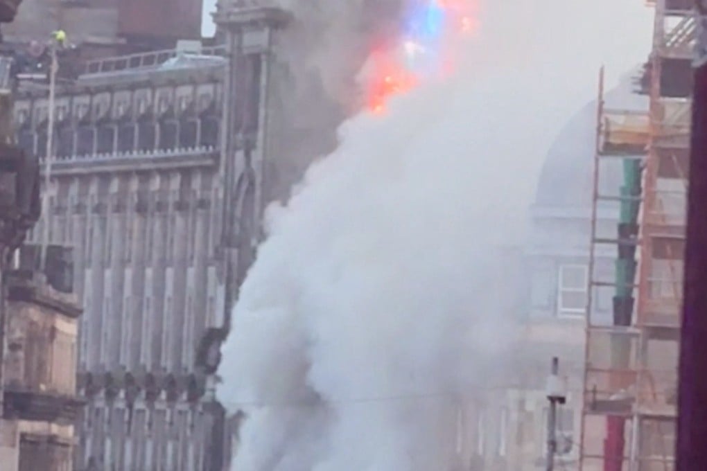 Smoke rises following a major fire at a building in Glasgow, Scotland. Photo: BRUNA GOMES via Instagram/Reuters