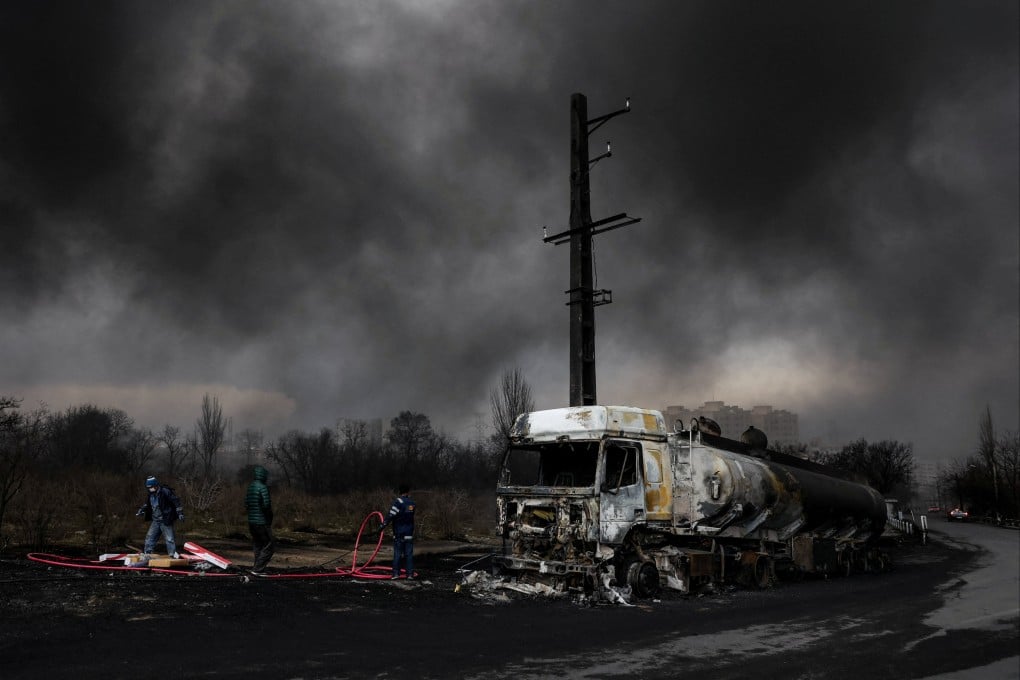 A destroyed vehicle after a reported strike on fuel tanks in Tehran, Iran. Photo: West Asia News Agency via Reuters