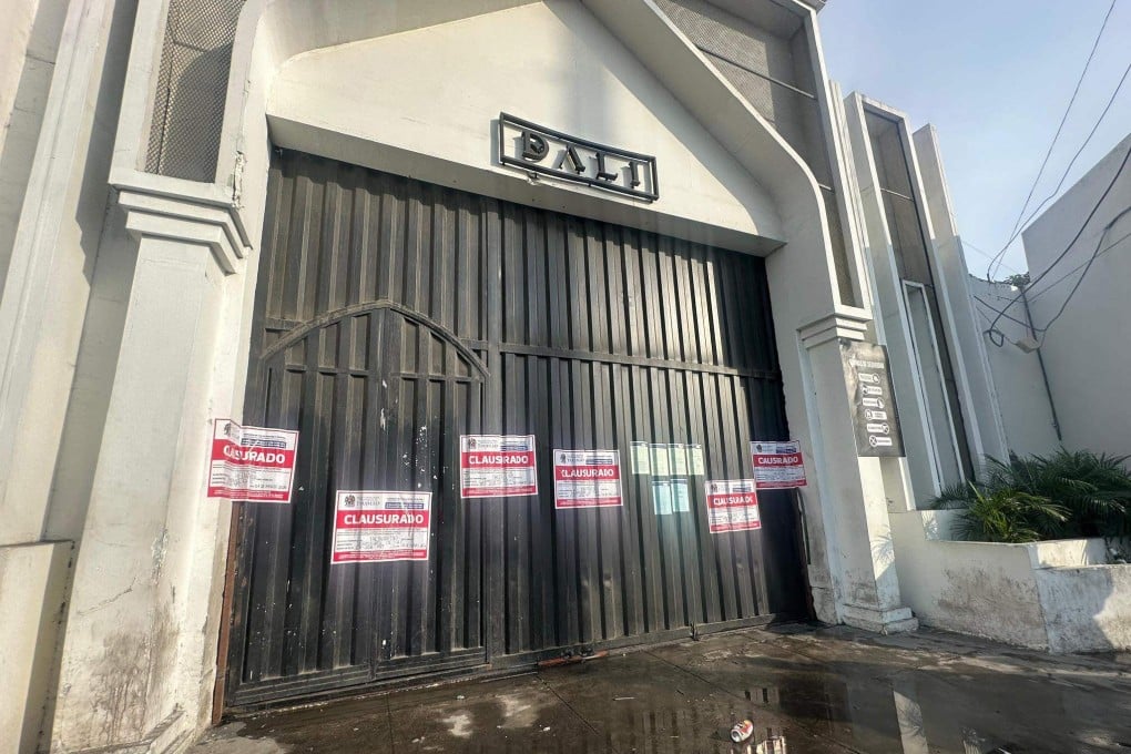 Closure notices at the entrance to the Dali nightclub following an explosion inside the venue. Photo: Provincial Municipality of Trujillo via AFP