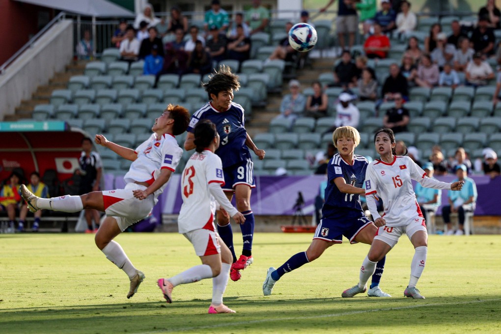 Riko Ueki (centre) scores Japan’s first goal against Vietnam in their Women’s Asian Cup clash in Perth. Photo: AFP