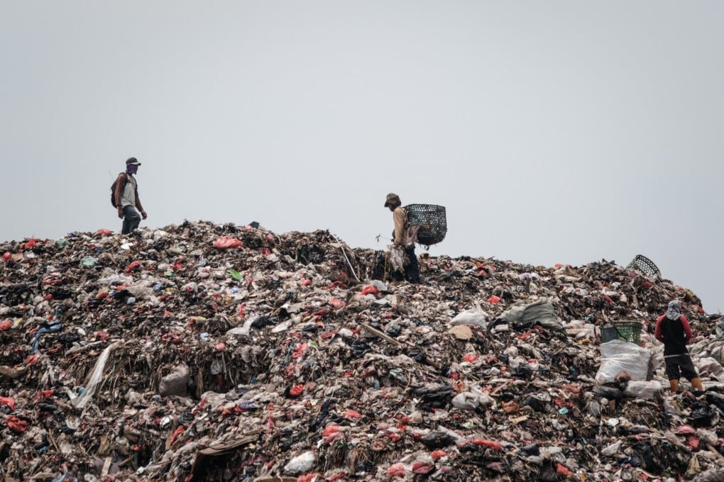 Registered scavengers walking in the Bantargebang landfill in Bekasi, on the outskirts of Jakarta. Photo: AFP