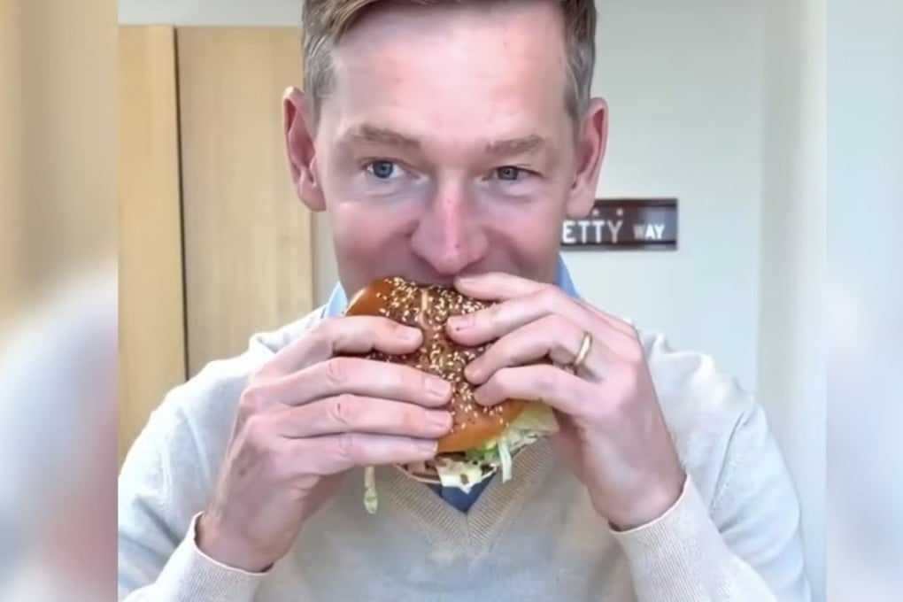 McDonald’s CEO Chris Kempczinski takes a bite of the fast food chain’s new Big Arch burger in a recent social media video posted by the company. Photo: YouTube