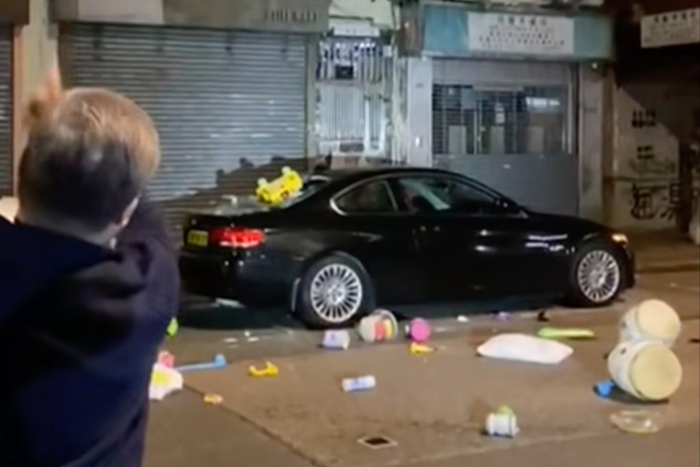 A video widely shared online shows several objects being thrown from the building’s fifth floor, hitting the car parked by the roadside and smashing its rear windscreen. Photo: Facebook