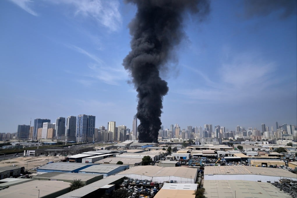 Smoke rises from a warehouse in the industrial area of Sharjah city in the United Arab Emirates on March 1 following reports of Iranian strikes. Photo: AP