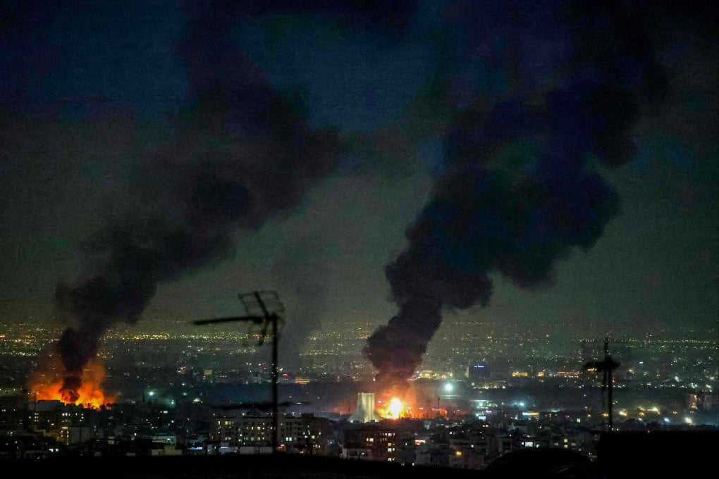 Plumes of smoke billow into the sky following air strikes near Mehrabad International Airport in Tehran on March 7. Photo: AFP