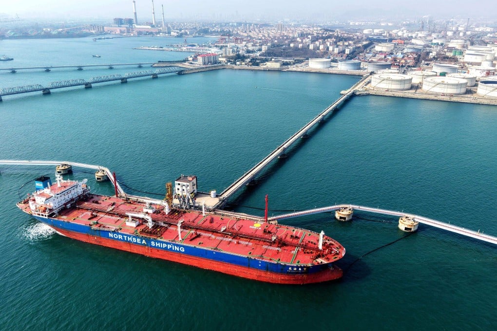 An oil tanker unloads crude oil at a terminal in Qingdao, Shandong province, on Tuesday. Photo: AFP