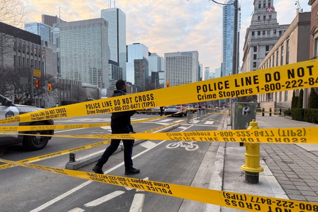 A law enforcement officer works outside the US consulate after shots were fired in Toronto on Tuesday. Photo: Reuters