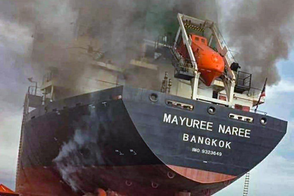 The Thai‑flagged cargo ship Mayuree Naree smoulders after being hit by Iranian missiles in the Strait of Hormuz on Wednesday. Photo: EPA/Royal Thai Navy