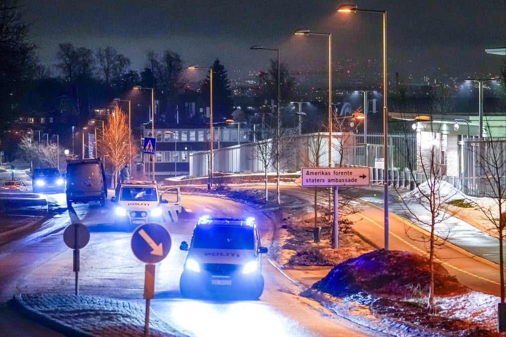 Police vehicles are seen at the US embassy in Oslo, Norway, on Sunday after an explosion was reported at the site. Photo: EPA