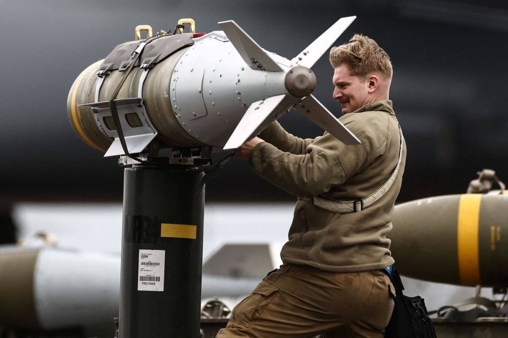 US Air Force military ground personnel prepare munitions for a bomber on Thursday. Photo: AFP