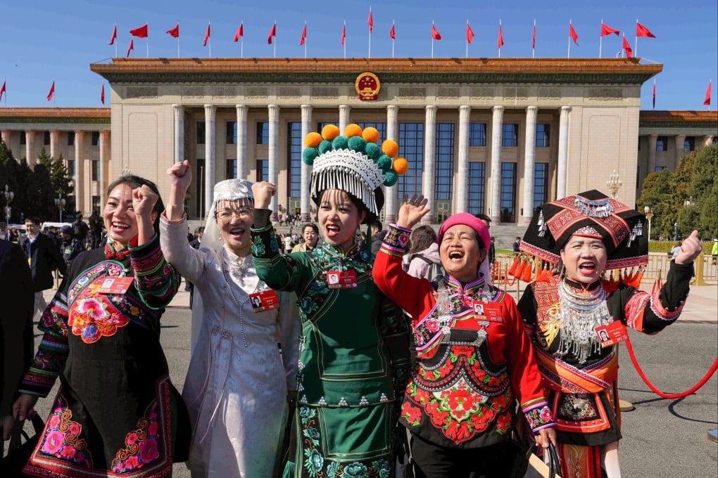 Ethnic minority delegates leave a plenary session of the National People’s Congress (NPC) held at the Great Hall of the People in Beijing on Monday. Photo: AP