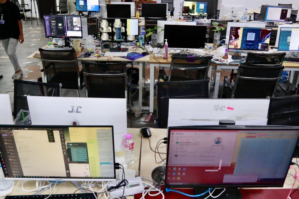 Workstations used by scam operators are seen after a police raid in Phnom Penh on Wednesday. Photo: EPA