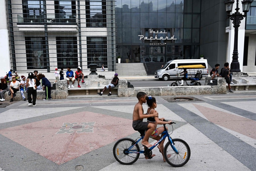 People spend time in the public area in front of a hotel in Havana, Cuba, on Thursday. Photo: AFP