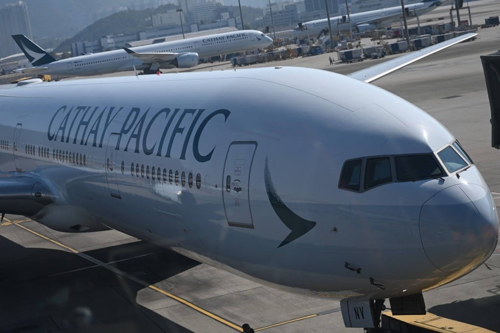 A Cathay Pacific plane stands at a gate at Hong Kong International Airport on January 25. Photo: dpa