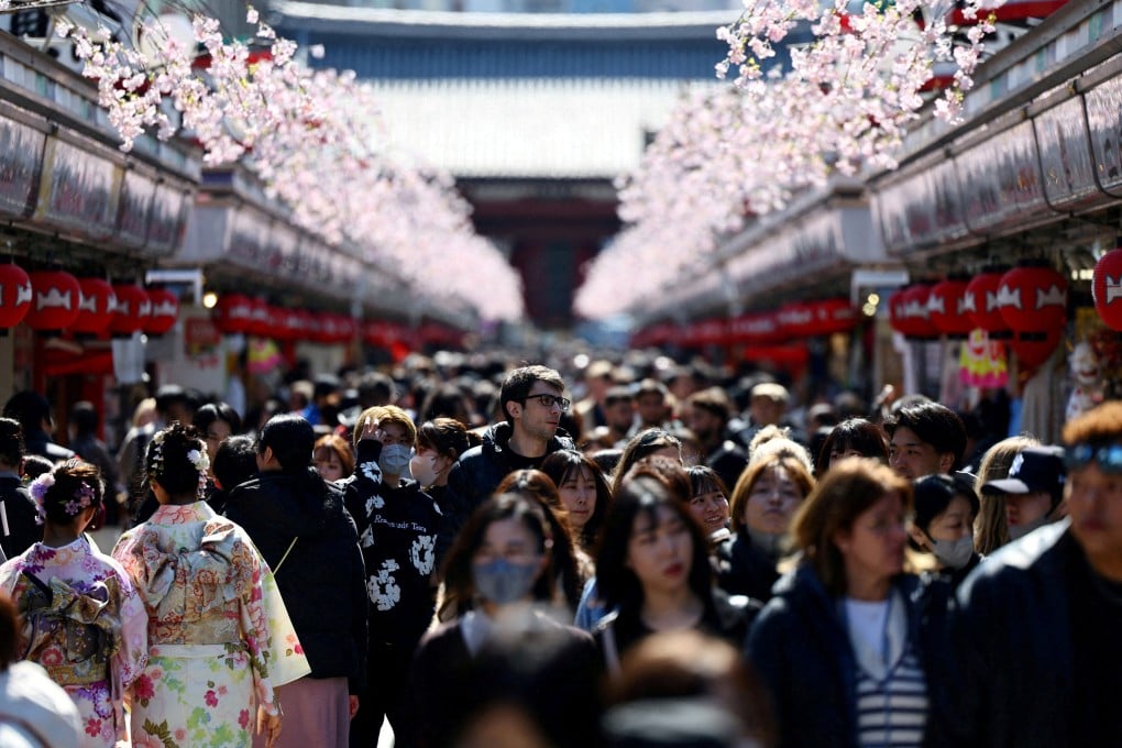 Visitors walk along Nakamise-dori street as they visit Sensoji temple at Asakusa district, a popular sightseeing spot in Tokyo, on March 10, 2025. Photo: Reuters