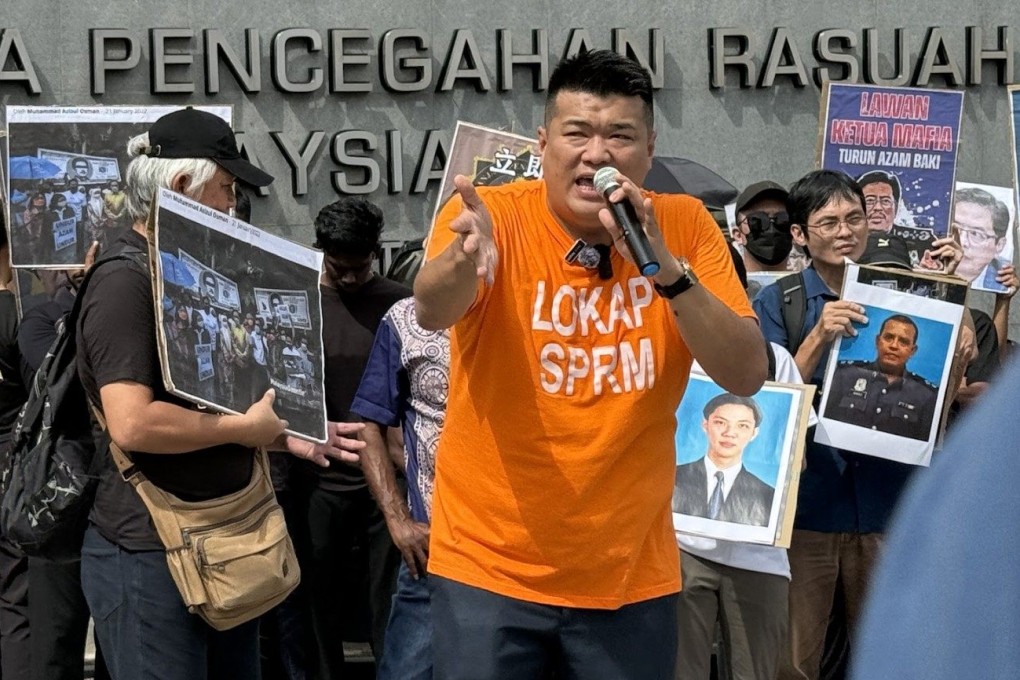 Rally organiser Albert Tei, clad in a mock prison outfit, speaks in front of the MACC headquarters in Putrajaya on February 27. Photo: Iman Muttaqin Yusof